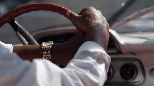 Close-up of hand holding car