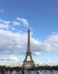 Communications tower against cloudy sky