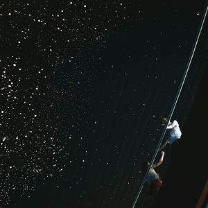 Low angle view of illuminated lights at night