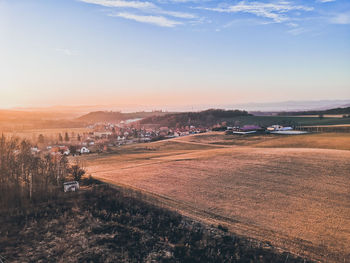 Scenic view of landscape against sky during sunset