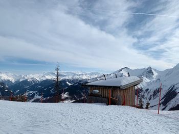 Scenic view of snow covered mountains against sky