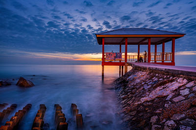 Scenic view of sea against sky at sunset