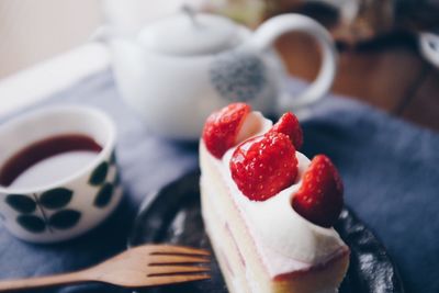 Close-up of strawberries in plate on table