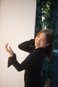 Portrait of young woman using mobile phone