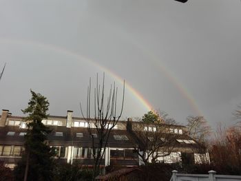 Rainbow over buildings