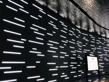 Low angle view of illuminated wall at night