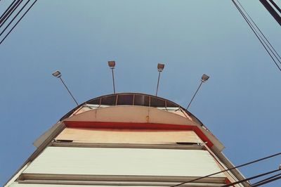 Low angle view of ferris wheel against clear sky