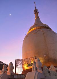 Low angle view of mosque against sky at dusk
