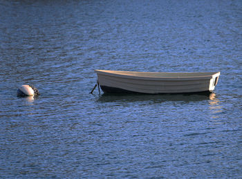 High angle view of boat moored in lake