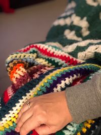 Close-up of woman hand with tattoo during winter