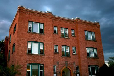 Low angle view of building in city against sky