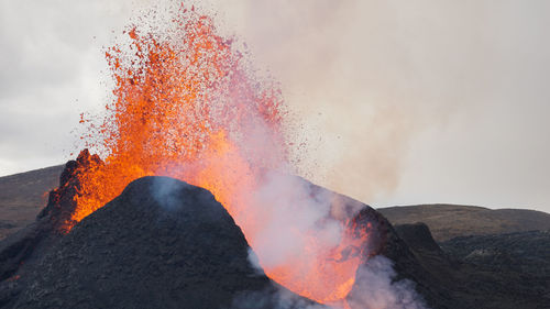 Scenic view of volcanic mountain against sky