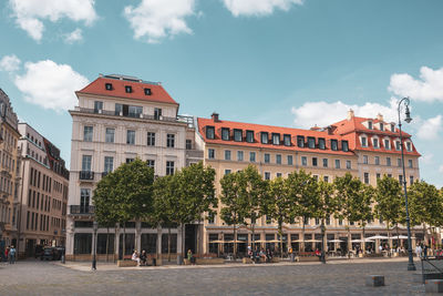 View of buildings against cloudy sky