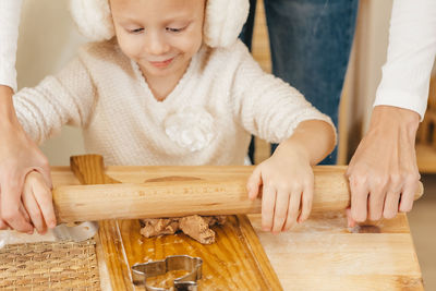 Close-up of cute baby boy sitting on table