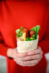 Close-up of hand holding ice cream