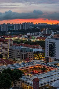 High angle view of illuminated buildings against sky during sunset