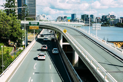 High angle view of elevated roads against cloudy sky during sunny day