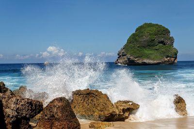 Scenic view of sea against clear blue sky