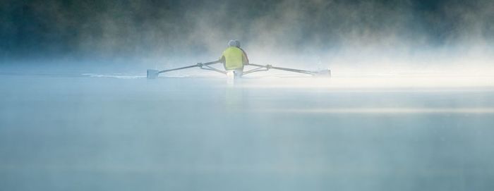 Low angle view of man standing on snow