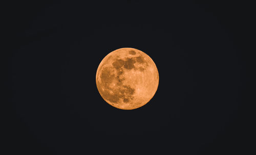 Low angle view of moon against sky at night