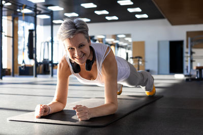 Young woman exercising in gym