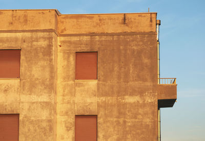 Low angle view of building during sunset