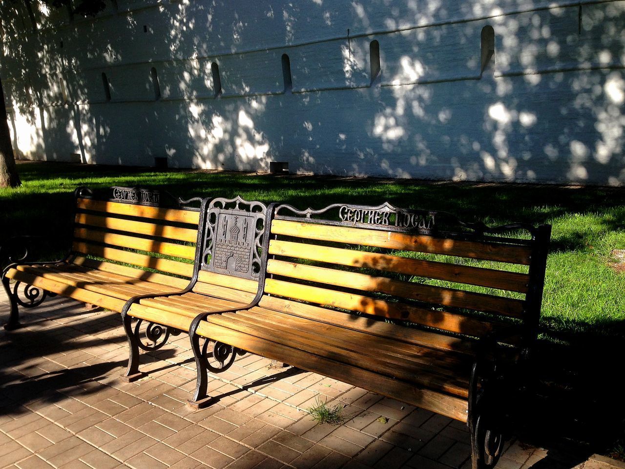 EMPTY BENCH AGAINST WALL