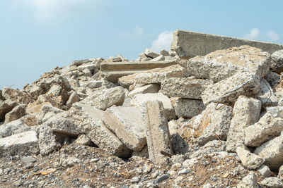 Low angle view of rock formation against sky