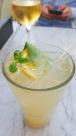 Close-up of fresh lemonade served on table at restaurant