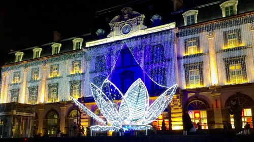 Low angle view of illuminated building at night