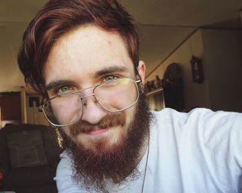 Close-up portrait of smiling young woman