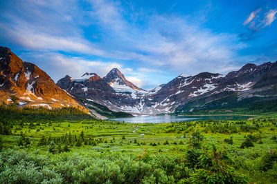 Scenic view of snowcapped mountain against cloudy sky