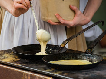 Mid section of woman looking at camera