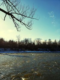 Scenic view of frozen lake against sky during winter