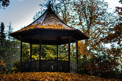 Gazebo in park against sky during autumn