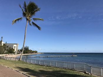 Scenic view of sea against blue sky