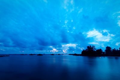 Scenic view of sea against dramatic sky