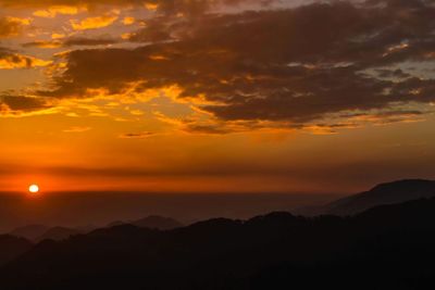 Scenic view of dramatic sky during sunset