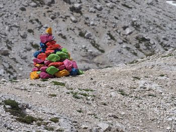 Close-up of colorful cairn by rocky mountains