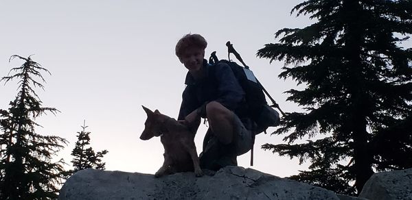 Low angle view of person riding horse against sky