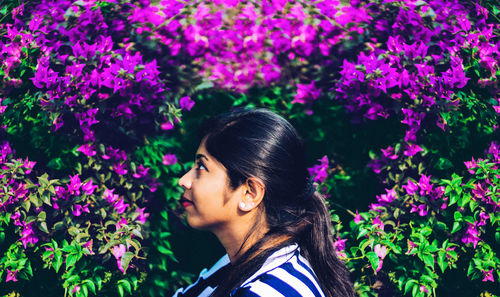 Portrait of woman with pink flowers