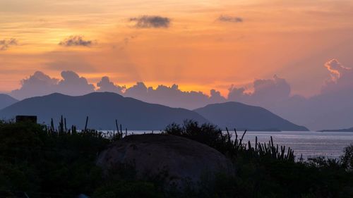 Scenic view of mountains at sunset