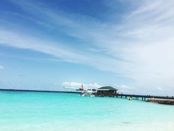 Scenic view of sea against blue sky