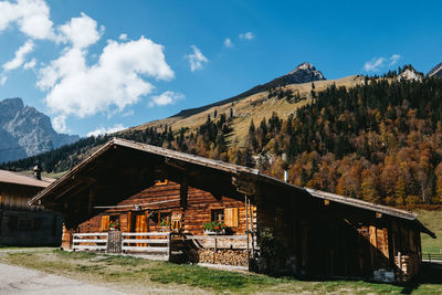 House on mountain against sky