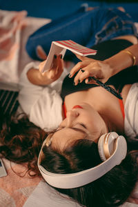 High angle view of people relaxing on laptop