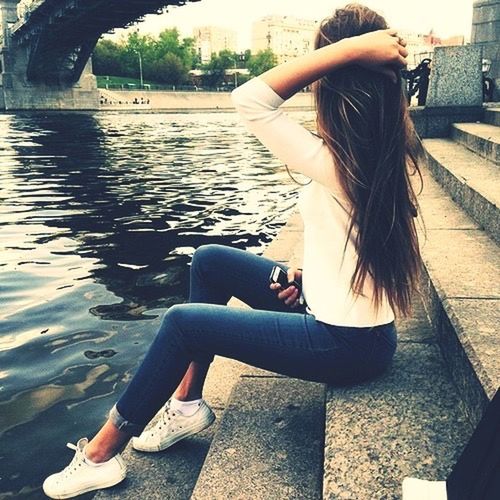 water, lifestyles, leisure activity, sitting, young adult, relaxation, young women, long hair, river, person, lake, rear view, side view, casual clothing, day, built structure