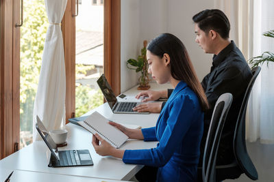 Business colleagues working in office