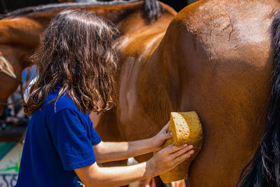 Side view of woman holding ice cream