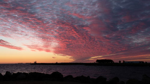 Scenic view of sea against dramatic sky