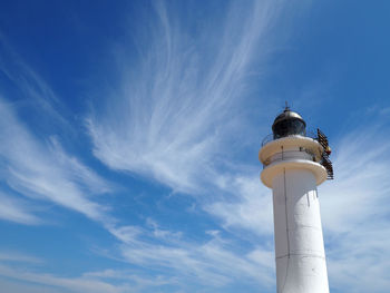 Low angle view of tower against blue sky